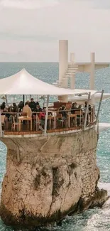 A stunning cliffside restaurant overlooking the ocean waves.