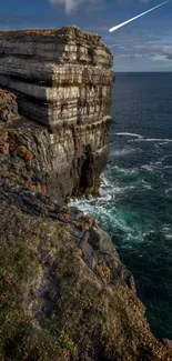 Cliffside ocean view with dramatic cliffs and serene water.