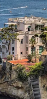 Cliffside villa with ocean view and greenery, ideal for mobile wallpaper.