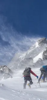 Climbers on snowy mountain under clear sky.