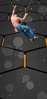 Climber scaling a hexagon-patterned wall with dynamic design.