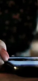 Close-up of hand interacting with smartphone screen.