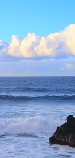 Serene ocean view with waves and a vibrant blue sky.