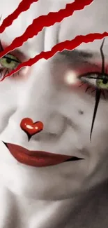 Clown face with red accents and striking green eyes mobile wallpaper.