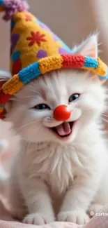 Cute white kitten wearing clown hat, smiling.