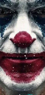 Clown face with vibrant colors and expressive makeup on a mobile wallpaper.