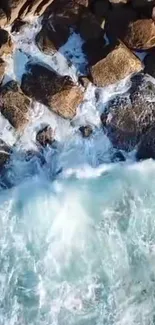 Aerial view of rocky coastline with crashing ocean waves.
