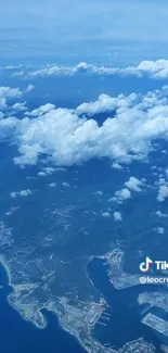 Aerial view of clouds above a coastline.