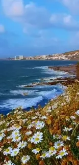 Blue sea with white flowers on a rocky coast under a clear sky.