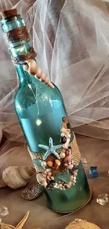 Decorative bottle with seashells and twine on a sandy background.