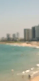 Blurred coastal cityscape mobile wallpaper with ocean and buildings.