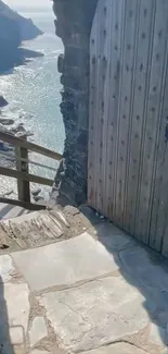 Stone doorway with a tranquil coastal view.