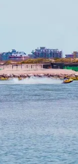 Jet ski speeding along a vibrant coastal shoreline with cityscape in the background.