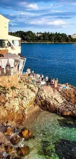 Scenic coastal view with azure waters and rocky shore.