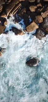 Aerial view of ocean waves hitting coastal rocks, showcasing nature's beauty.