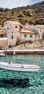 Turquoise coastal village with boat and stone houses.