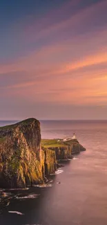 Sunset over coastal cliff with ocean view.