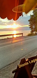 Sunset view over the road by the coast in warm orange tones.