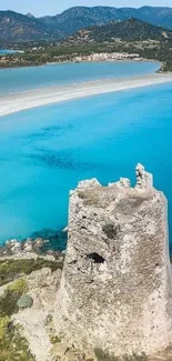 Scenic coastal view with stone tower and turquoise waters.