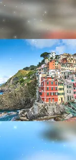 Colorful coastal village with ocean view and vibrant cliffside houses.