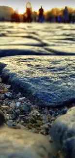 Close-up of cobblestone path at sunset with blurred background.