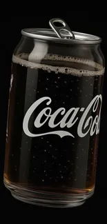 Coca-Cola can on a black background with visible bubbles.