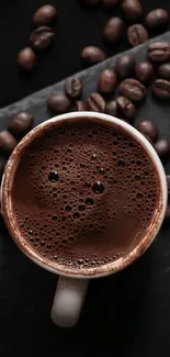 Close-up of coffee cup with beans on dark background.