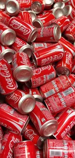 Pile of vibrant red Coca-Cola cans, perfect for a spirited phone wallpaper.