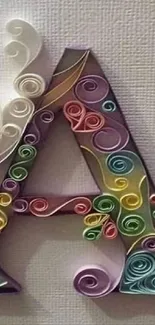 3D letter A with swirling colorful paper art design.