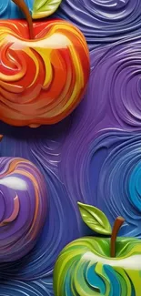 Three colorful apples on a swirling, abstract purple background.