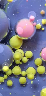 Vibrant abstract wallpaper with bubbles in purple, yellow, and pink.