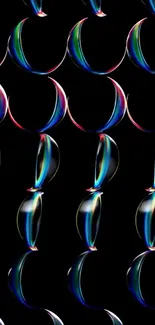 Colorful abstract circles on black wallpaper.