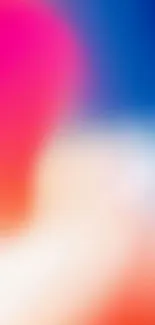 Vibrant abstract gradient wallpaper with pink and blue hues blending seamlessly.