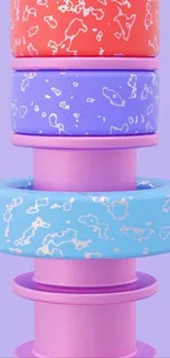 Colorful stacked abstract rings on light purple background.