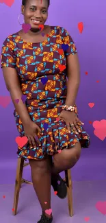 Woman in colorful African dress on a purple background.