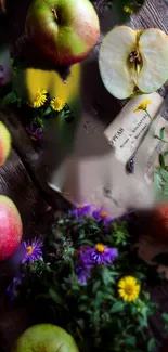 Artistic display of apples and flowers on a rustic wooden background.