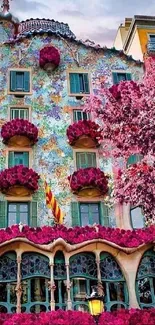 Colorful building with floral designs and pink hues, perfect for mobile wallpaper.