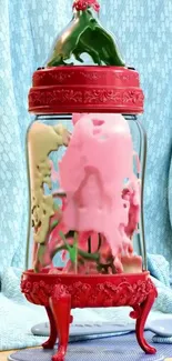 A vibrant red glass jar with artistic splashes and a blue background.