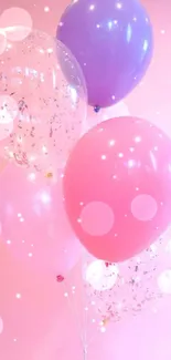 Pastel pink background with colorful balloons.