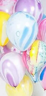 Colorful balloons with vibrant patterns for mobile wallpaper.