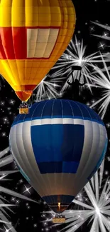 Hot air balloons with fireworks in the night sky wallpaper.