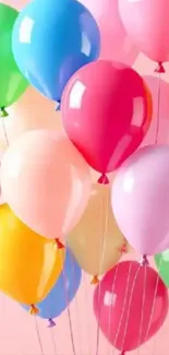 Vibrant wallpaper with colorful balloons floating.