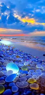 Colorful pebbles on a sunset beach with an ocean view.