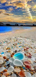 Vibrant beach pebbles under a scenic ocean sunset.