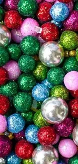 Colorful beads in red, green, blue, pink, and metallic tones for mobile wallpaper.