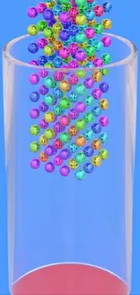 Colorful beads cascading into a clear glass on a blue background.