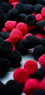 Colorful red and black berry candy wallpaper for mobile devices.