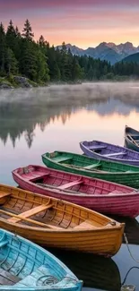 Colorful boats lined up on a misty lake at sunrise with mountain views.