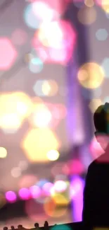 Silhouette with vibrant bokeh lights and pink hues in background.