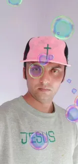 Man wearing cross cap, surrounded by colorful bubbles.